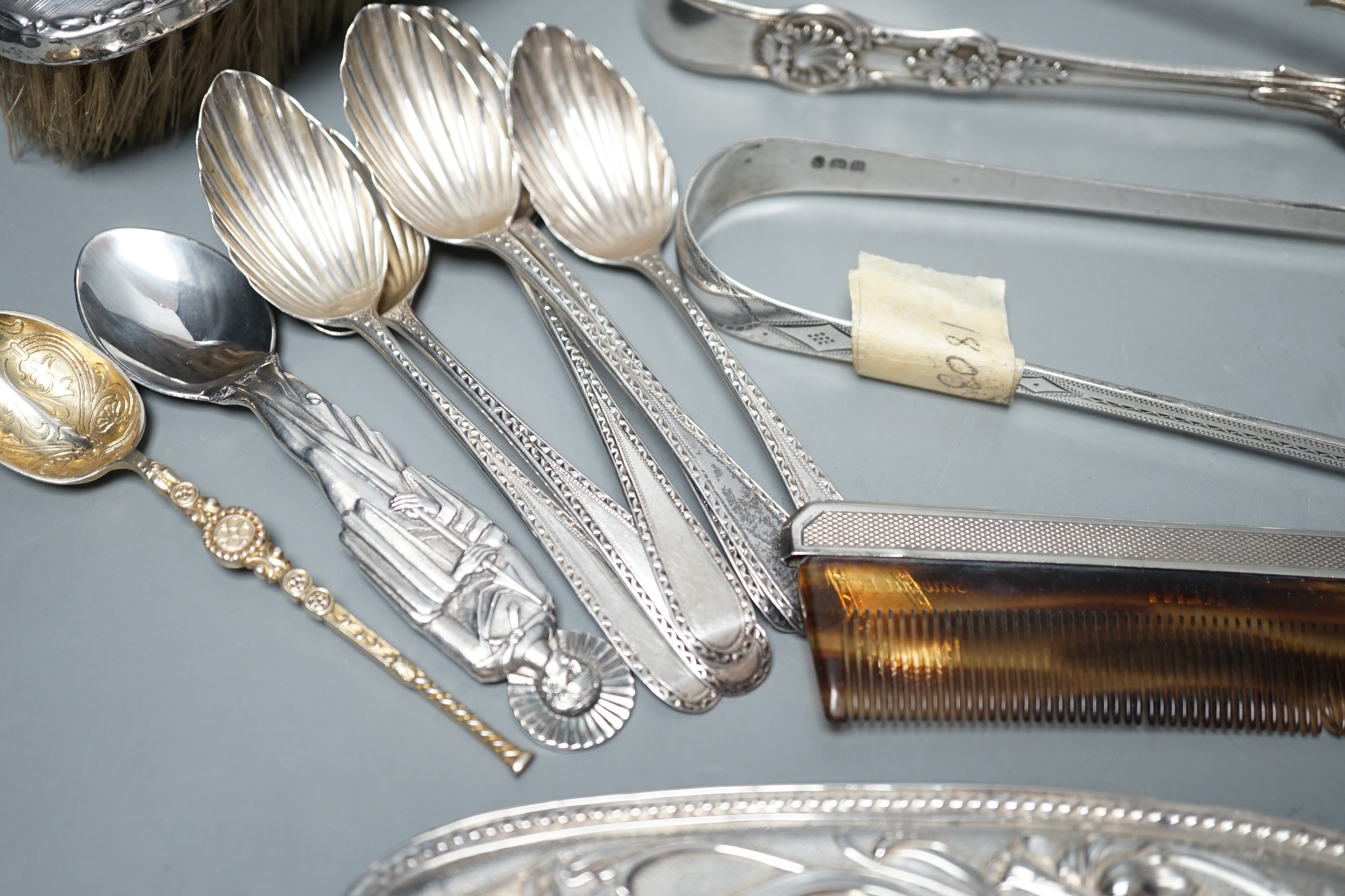 A small quantity of assorted silver flatware including a set of six teaspoons, by Peter, Ann & William Bateman, London, 1800, a pair of Victorian tablespoons, three pairs of silver sugar tongs etc. and a pewter spoon and